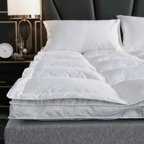 Segreti del sonno dell'hotel: perché il topper a doppio materasso down down è così popolare?